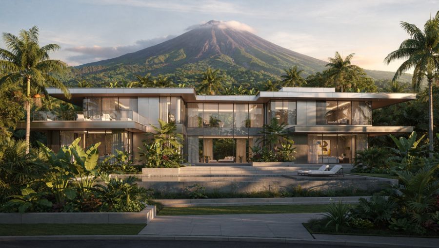 Long modern estate home with a volcano rising behind it